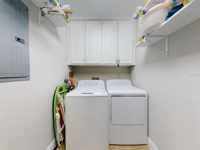 a patio with wooden floor and outdoor seating