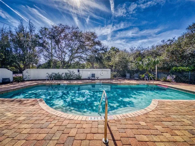 an aerial view of a house with yard