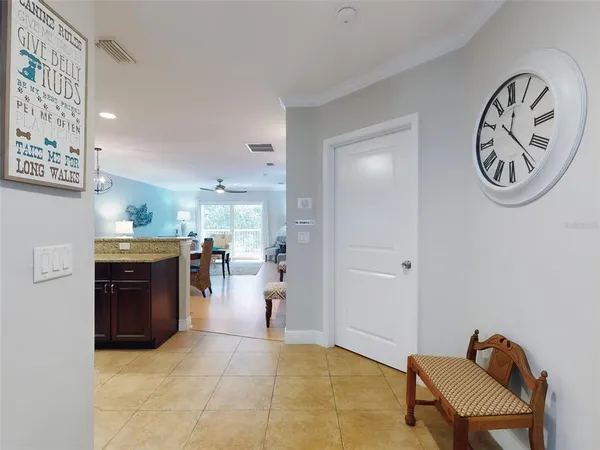 a kitchen with stainless steel appliances granite countertop a stove refrigerator and cabinets