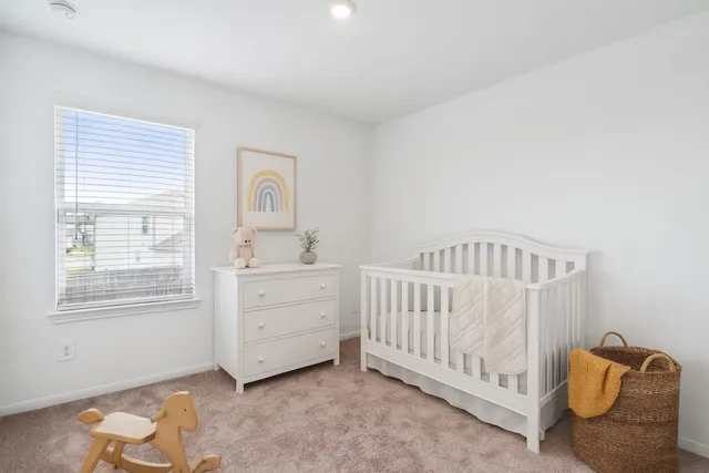 a bedroom with furniture and window