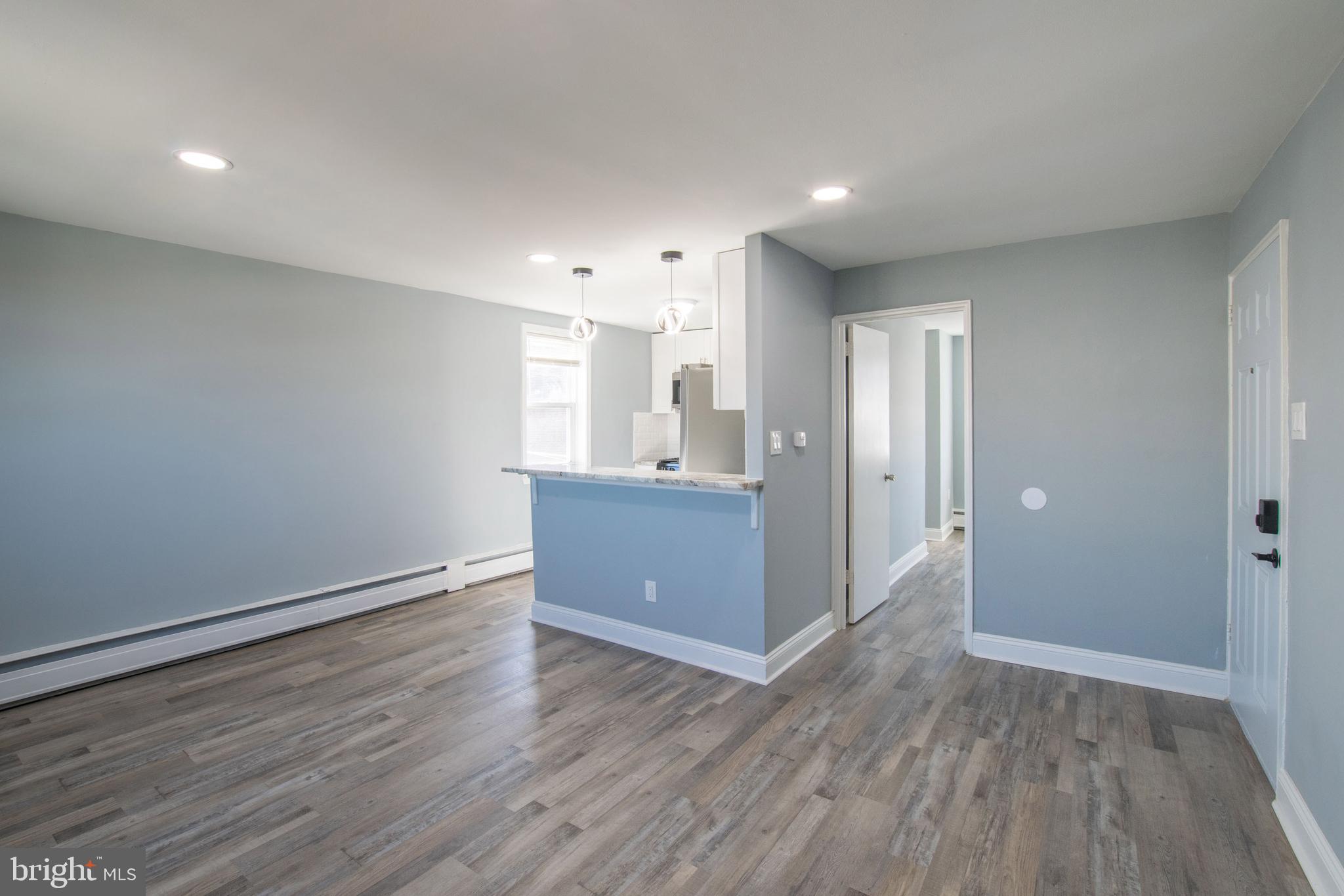 5905 Houghton Street, Unit 2 Philadelphia, PA 19128 - Photo 2 of 14 a view of a kitchen with wooden floor and a sink
