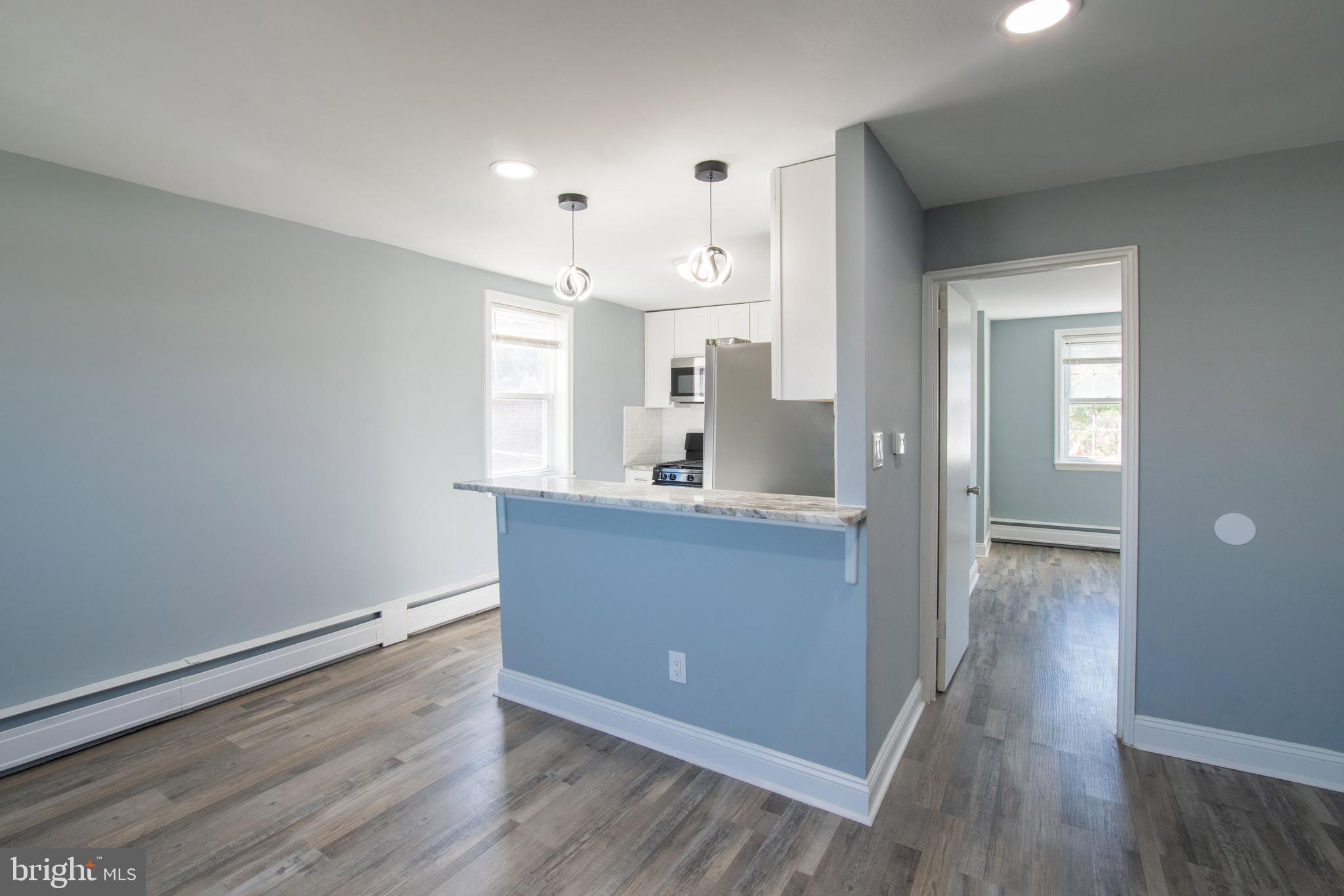 5905 Houghton Street, Unit 2 Philadelphia, PA 19128 - Photo 5 of 14 a view of kitchen with sink and wooden floor