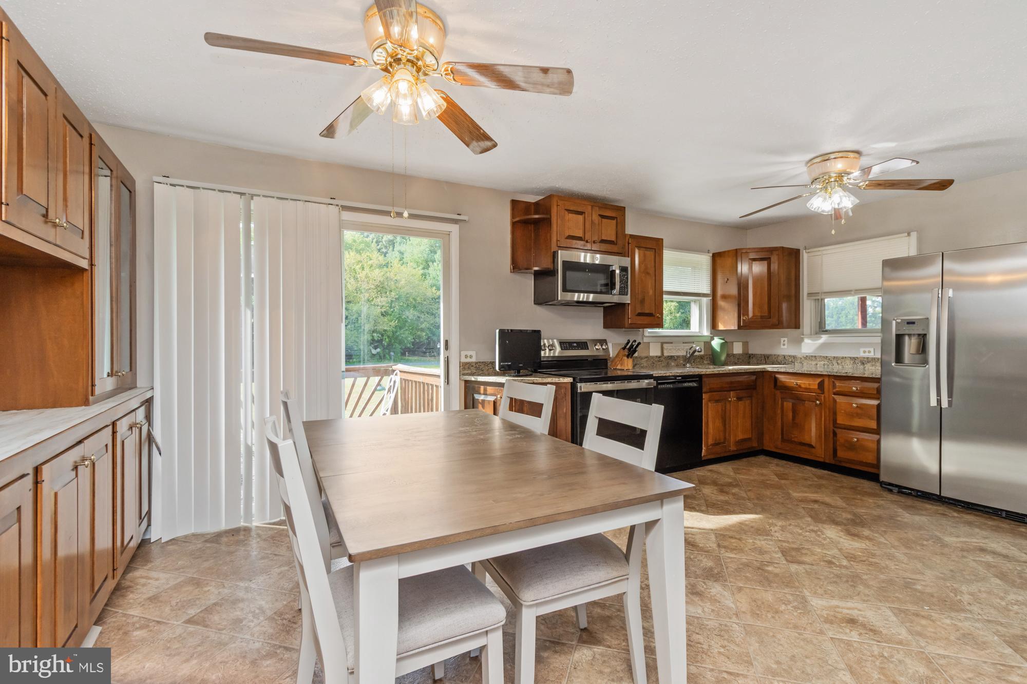 3622 Claires Lane Baltimore, MD 21220 - Photo 14 of 43 a kitchen with kitchen island a large counter top space appliances and a center island
