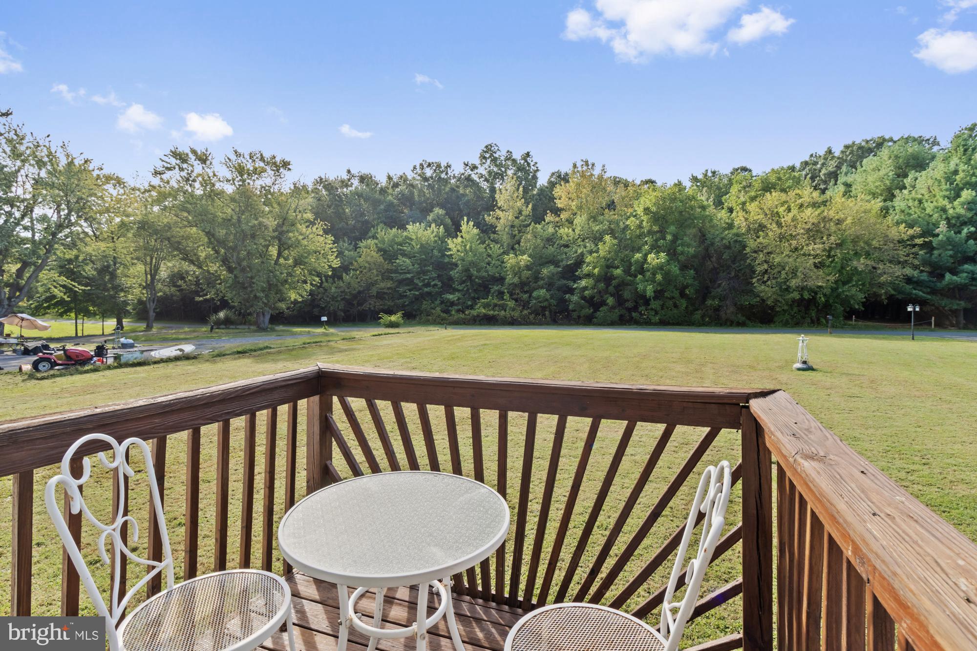 3622 Claires Lane Baltimore, MD 21220 - Photo 15 of 43 a view of a balcony with wooden floor and outdoor seating