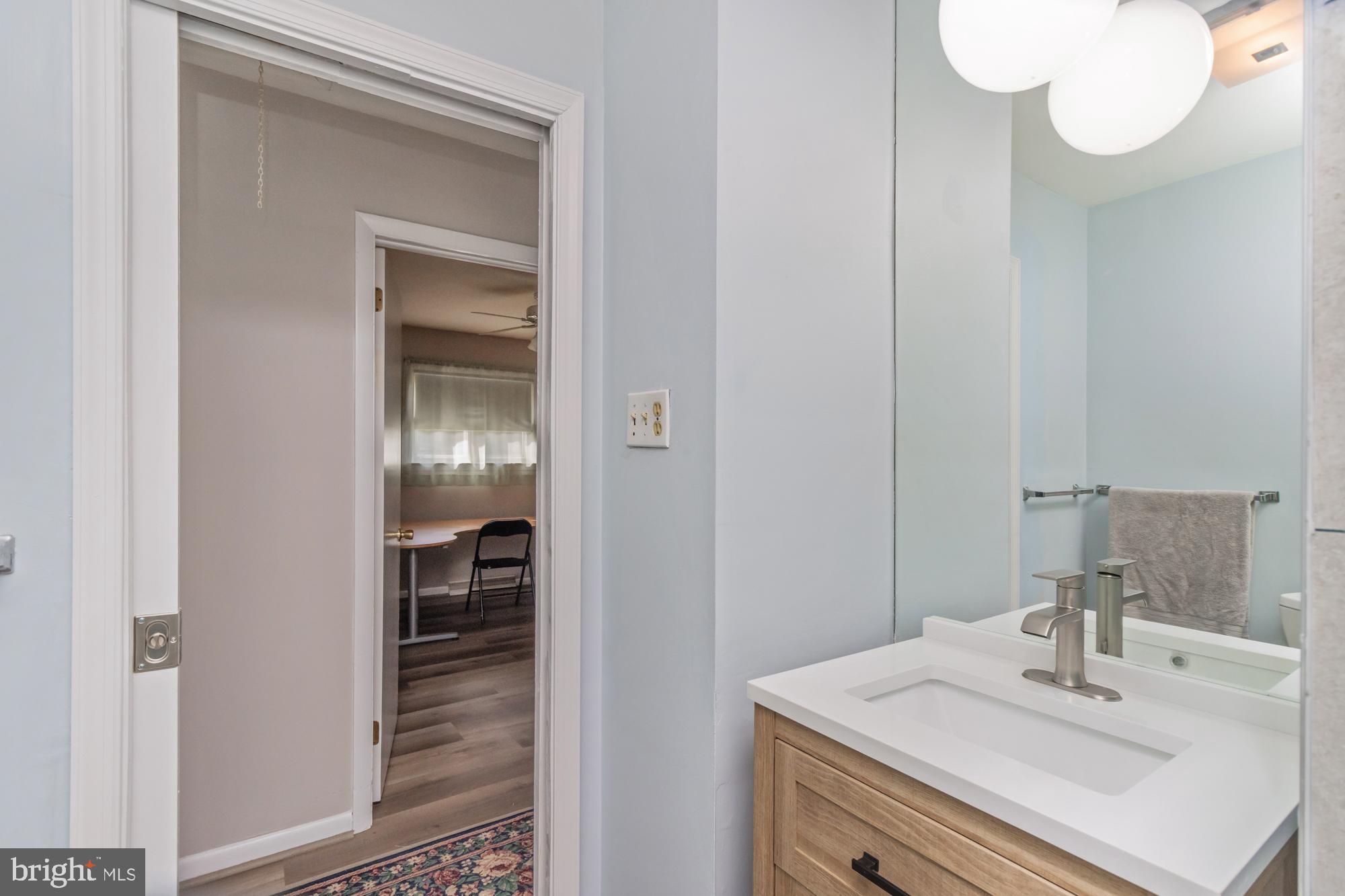 3622 Claires Lane Baltimore, MD 21220 - Photo 23 of 43 a bathroom with a sink and a mirror