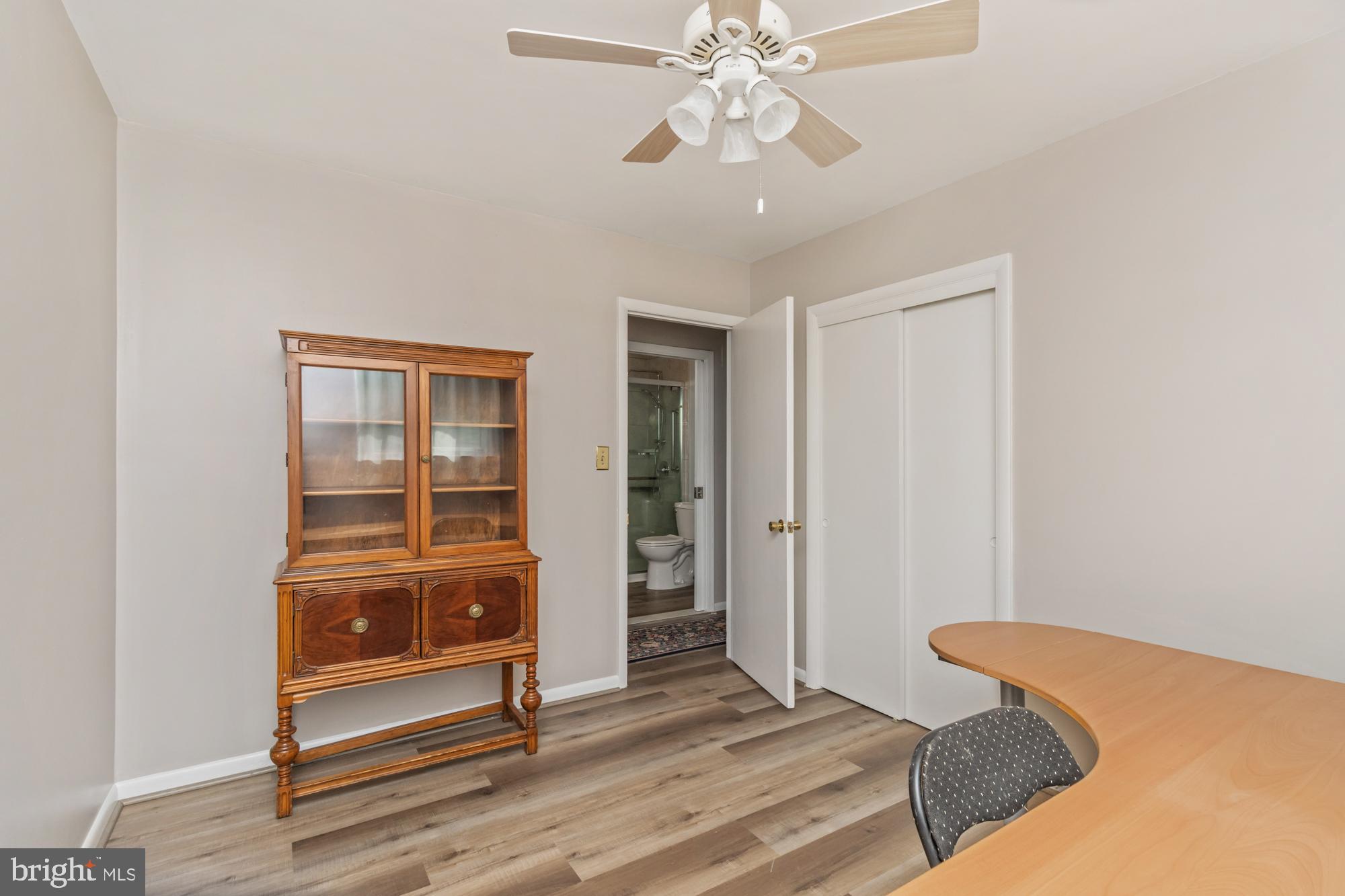 3622 Claires Lane Baltimore, MD 21220 - Photo 26 of 43 a bedroom with a bed and a chandelier