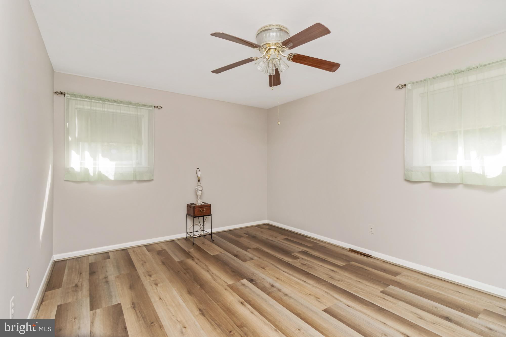 3622 Claires Lane Baltimore, MD 21220 - Photo 27 of 43 a bedroom with a bed and a chandelier