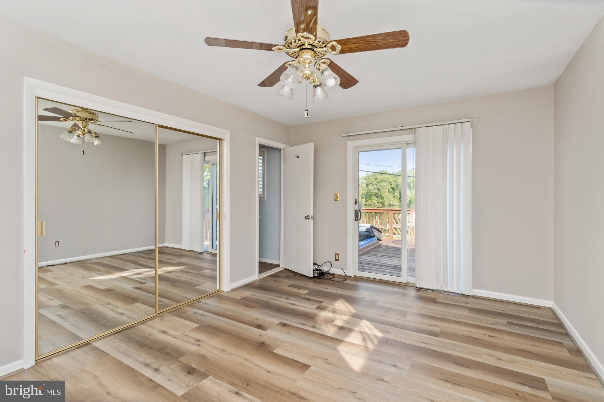 3622 Claires Lane Baltimore, MD 21220 - Photo 30 of 43 a view of empty room with window and ceiling fan