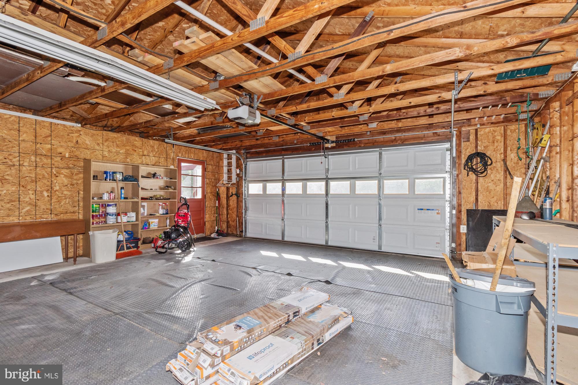 3622 Claires Lane Baltimore, MD 21220 - Photo 40 of 43 a view of a garage with wooden floor