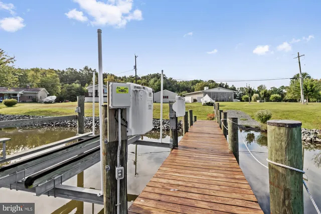 a view of a balcony with yard