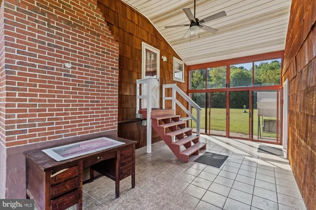 a view of a patio with a table and chairs