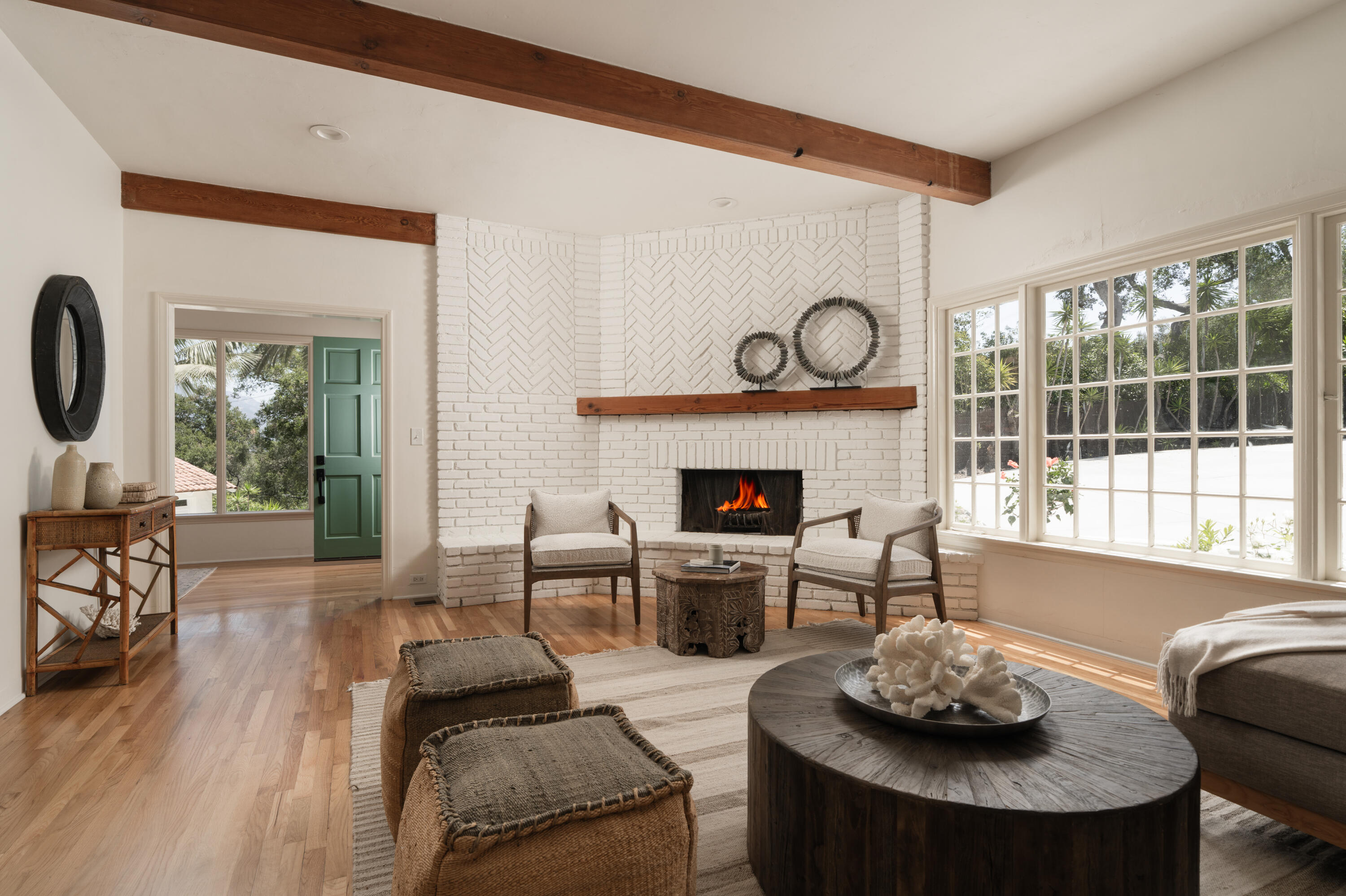 939 Arcady Road Santa Barbara, CA 93108 - Photo 4 of 28 a living room with furniture a fireplace and a table