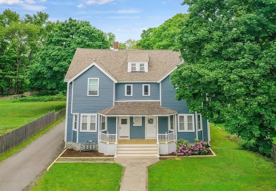 43 Sherman Street, Unit 2 Foxboro, MA 02035 - Photo 24 of 24 a front view of a house with a garden