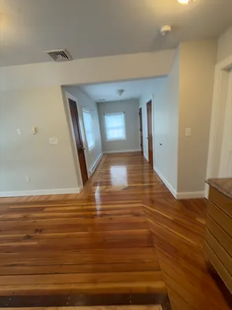 a view of a livingroom with wooden floor