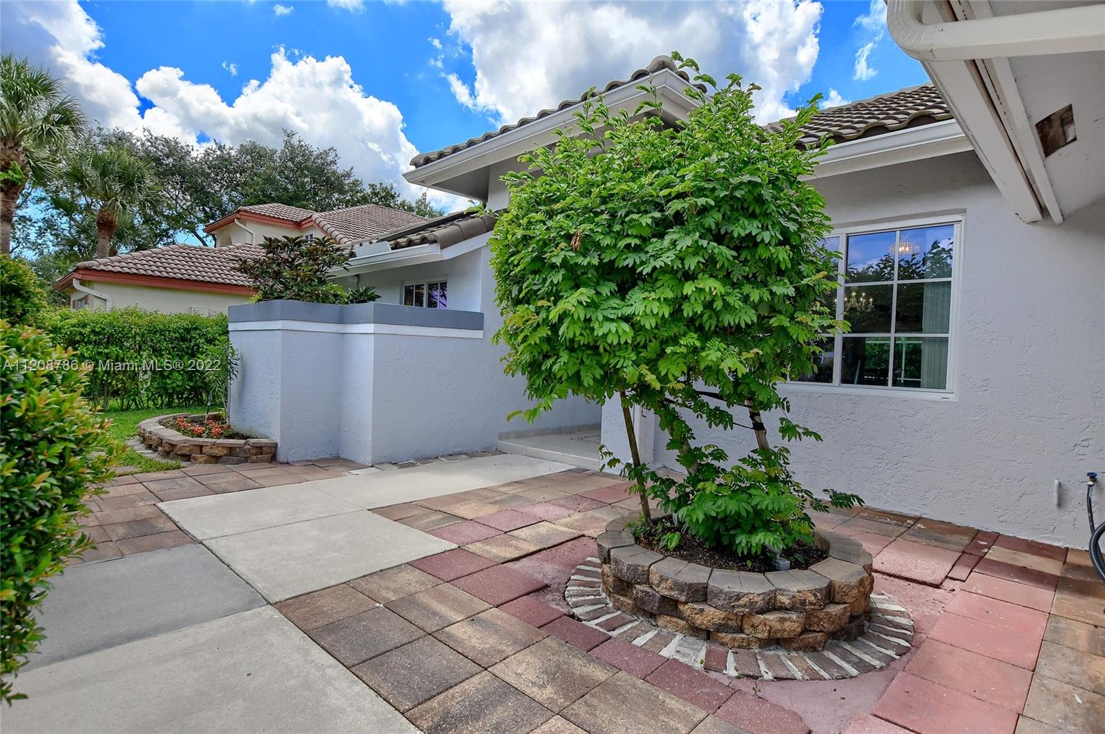 9580 Carousel Circle South Boca Raton, FL 33434 - Photo 3 of 35 a house with lots of trees in front of it