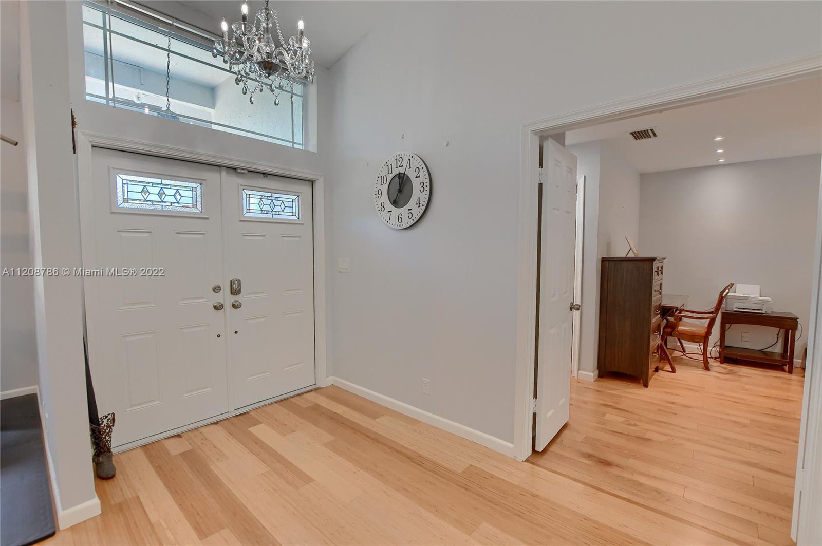 9580 Carousel Circle South Boca Raton, FL 33434 - Photo 5 of 35 a view of a livingroom with wooden floor and workspace