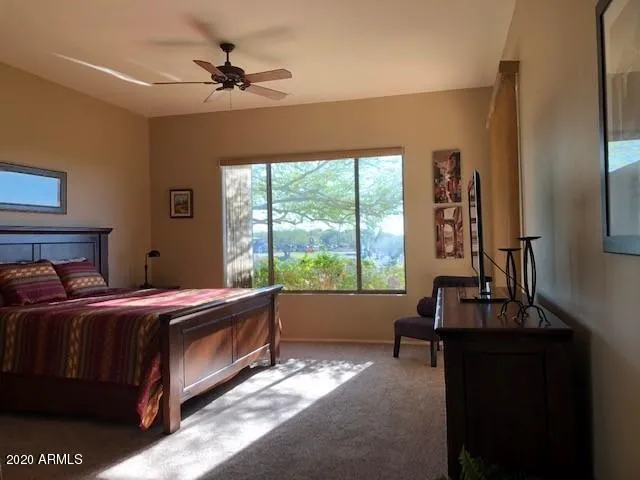 a bed room with a bed and a window