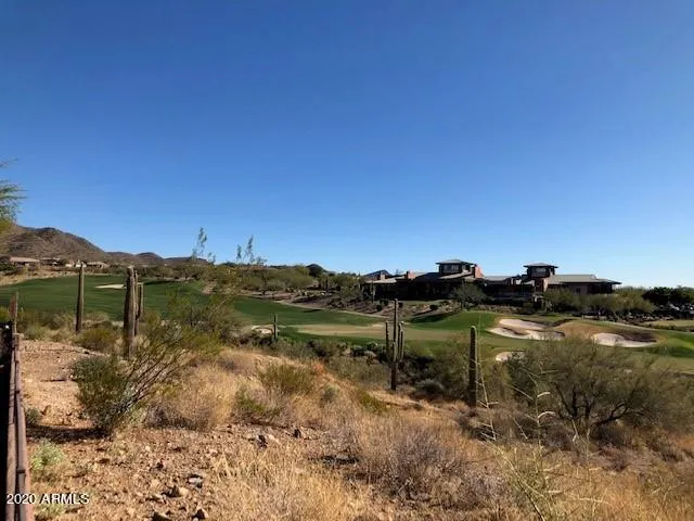 a view of a town with mountains in the background