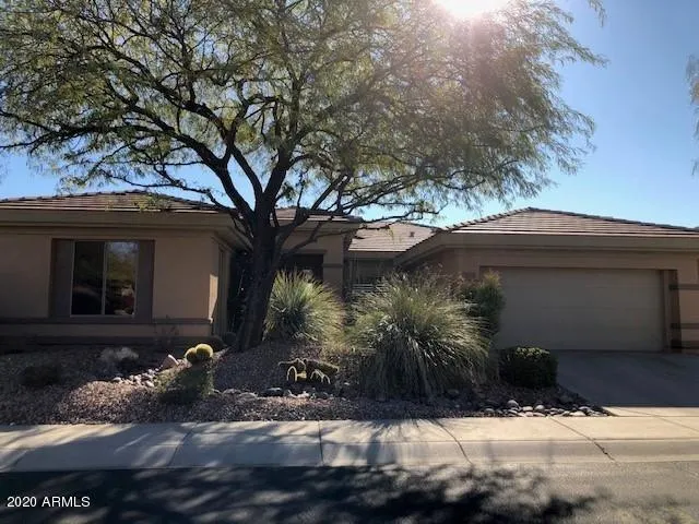 a view of house with a yard