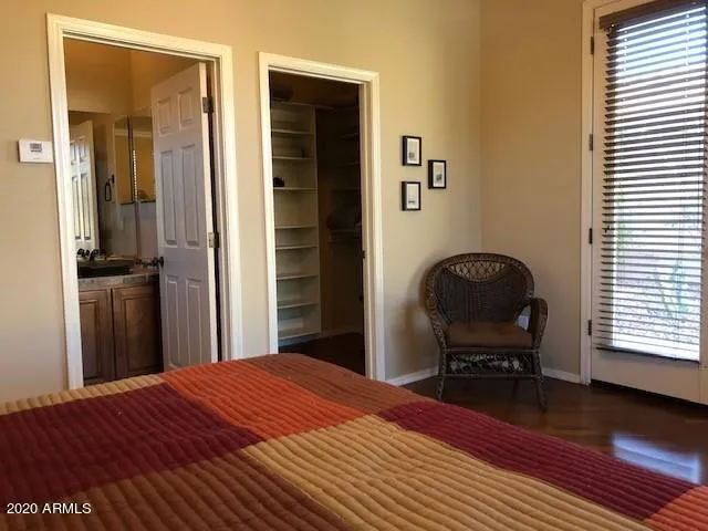 a bedroom with a bed piano and a window