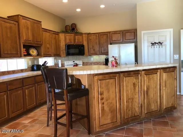 a kitchen with a sink cabinets and window