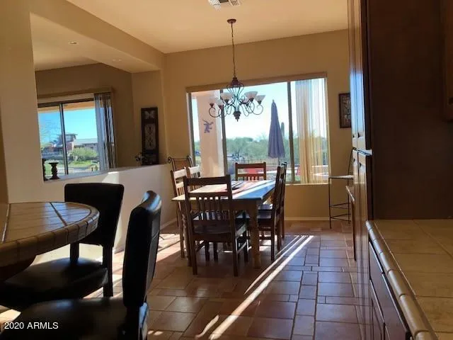 a view of a dining room with furniture window and outside view