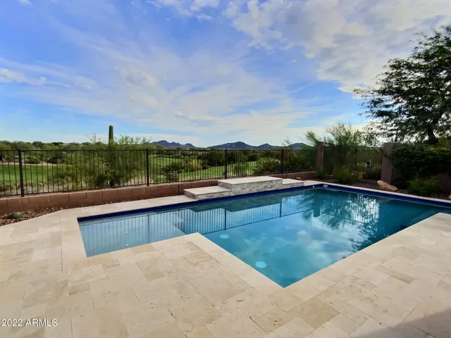 a view of a green field with clear sky