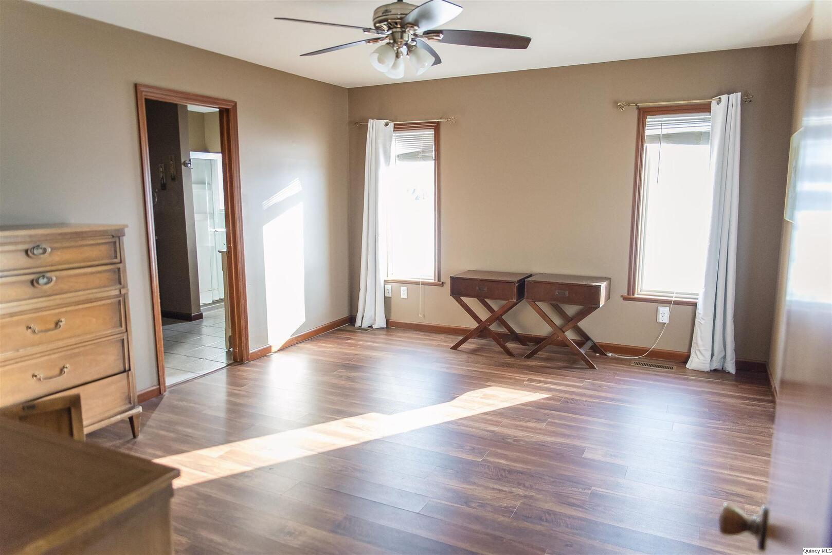 2208 Cherry Lane Quincy, IL 62301 - Photo 6 of 10 a view of a livingroom with wooden floor and a cabinet