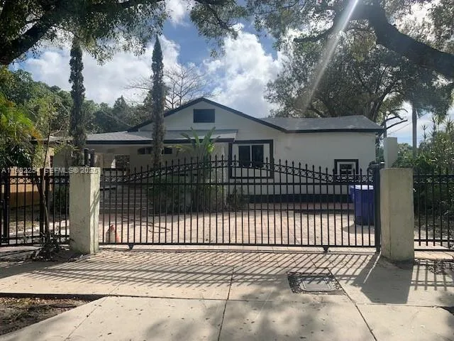 a front view of a house with a garden and pathway