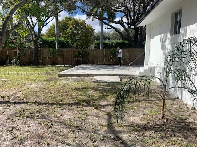 a view of a yard with a slide