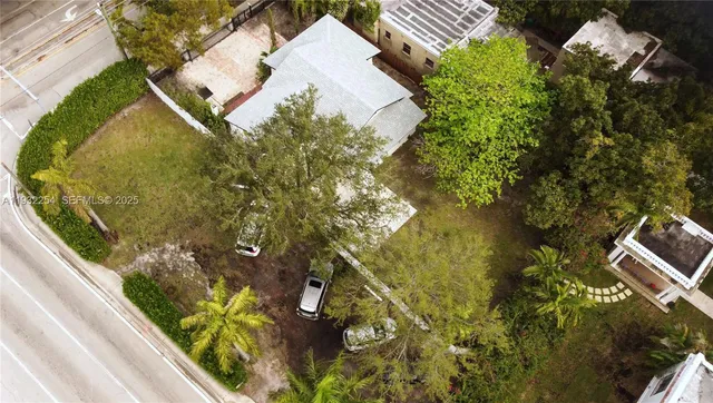 an aerial view of residential house with pool