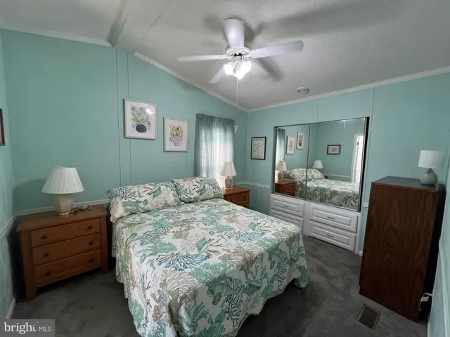 a bedroom with bed and a window