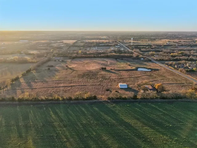 an aerial view of residential building and ocean