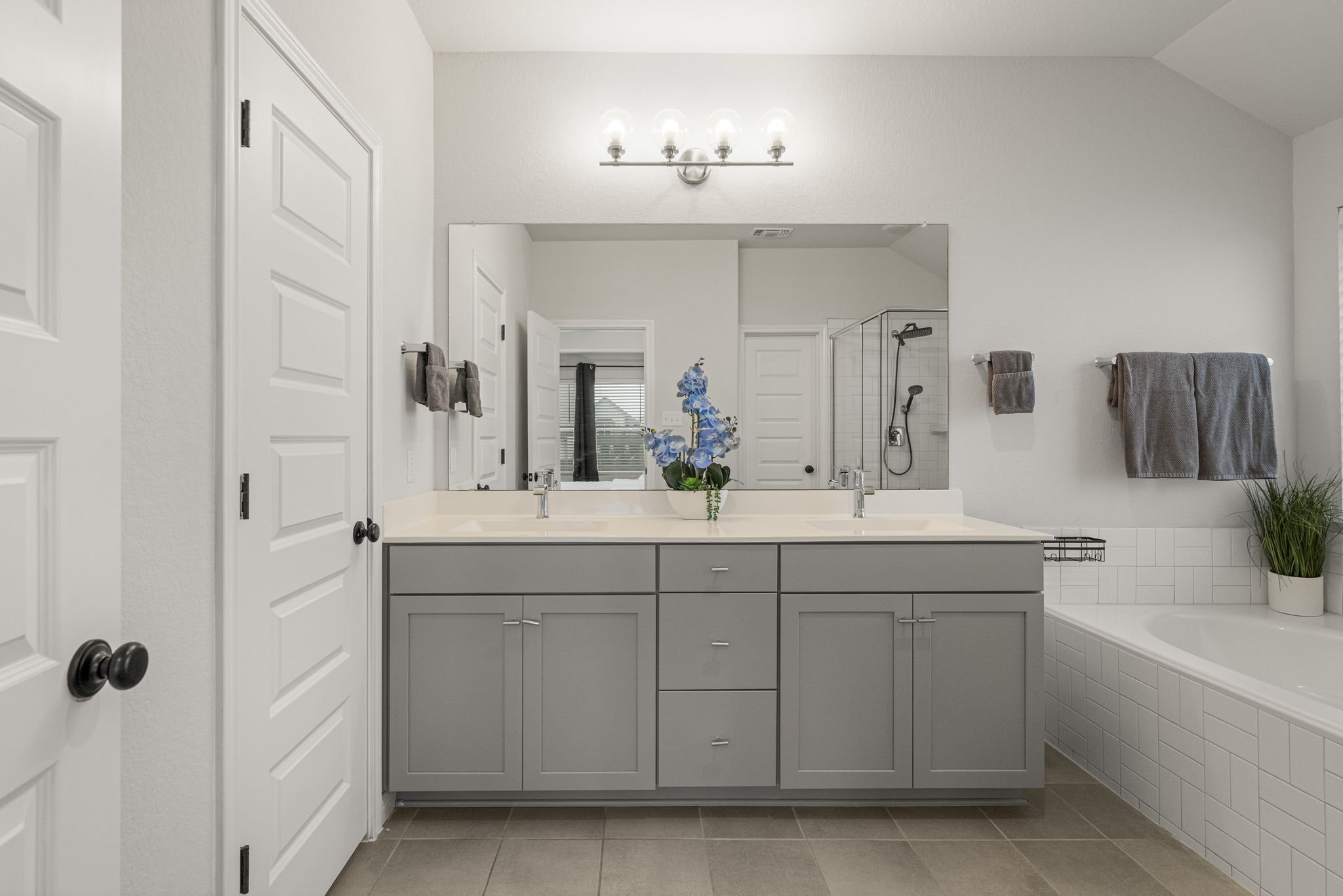 19412 Forman Drive Pflugerville, TX 78660 - Photo 20 of 34 The spacious primary bathroom features a large dual vanity with ample counter space for daily routines.