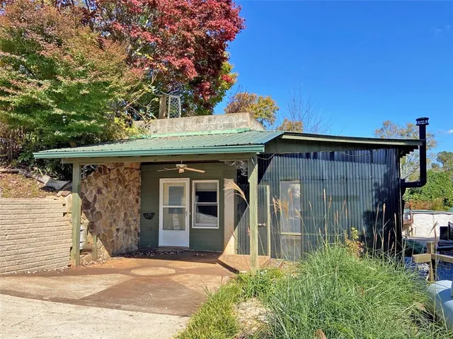 a view of a backyard with sitting area