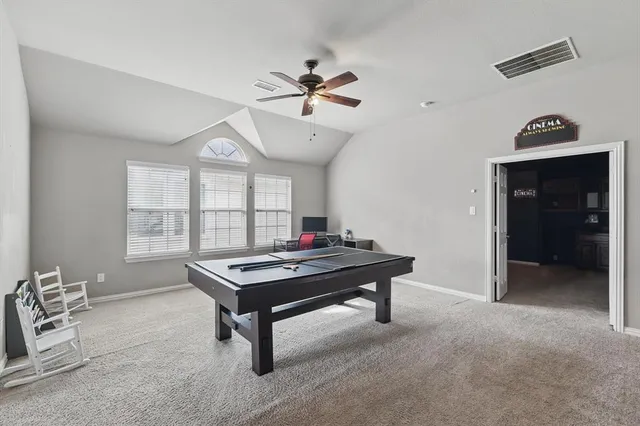 a living room with furniture a window and a chandelier