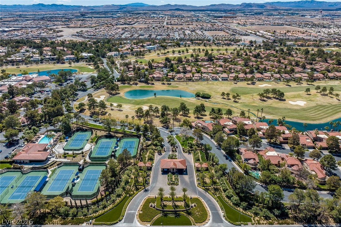 20 Innisbrook Avenue Las Vegas, NV 89113 - Photo 36 of 39 An aerial perspective reveals a vibrant community featuring an extensive golf course, serene ponds, and multiple tennis courts.