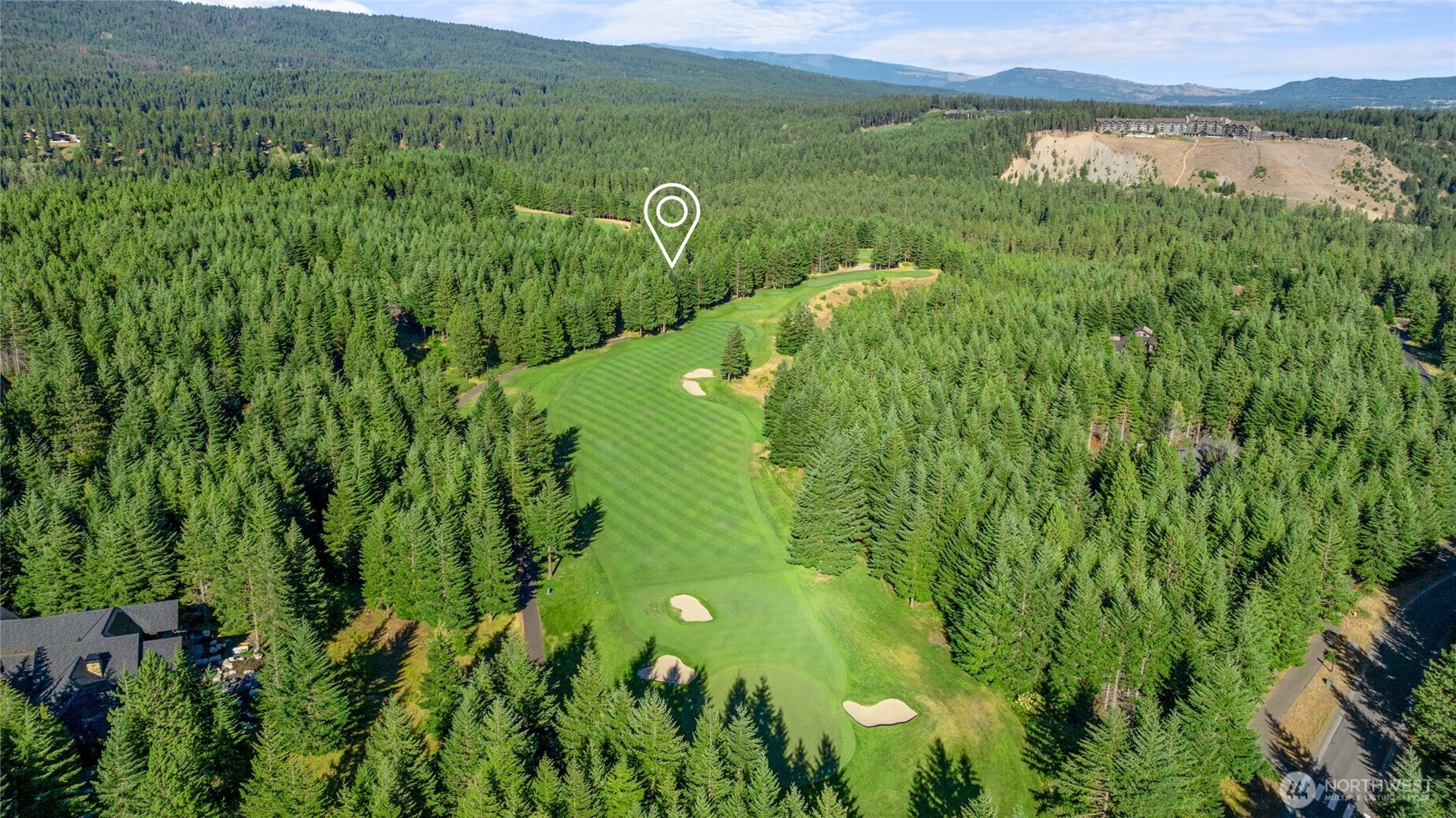 151 Rushing Water Lane Cle Elum, WA 98922 - Photo 38 of 40 a view of a lush green hillside next to a building
