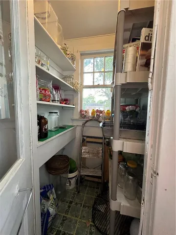a kitchen with a refrigerator and a stove