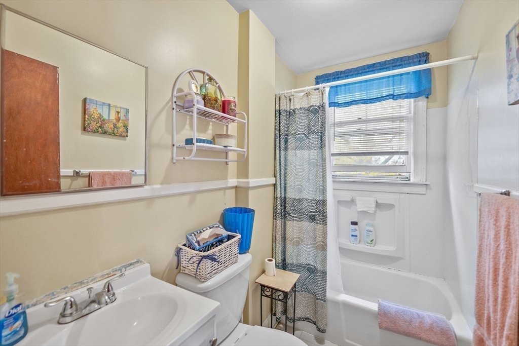 286 Columbia Street Fall River, MA 02721 - Photo 11 of 29 a bathroom with a sink mirror bathtub and toilet