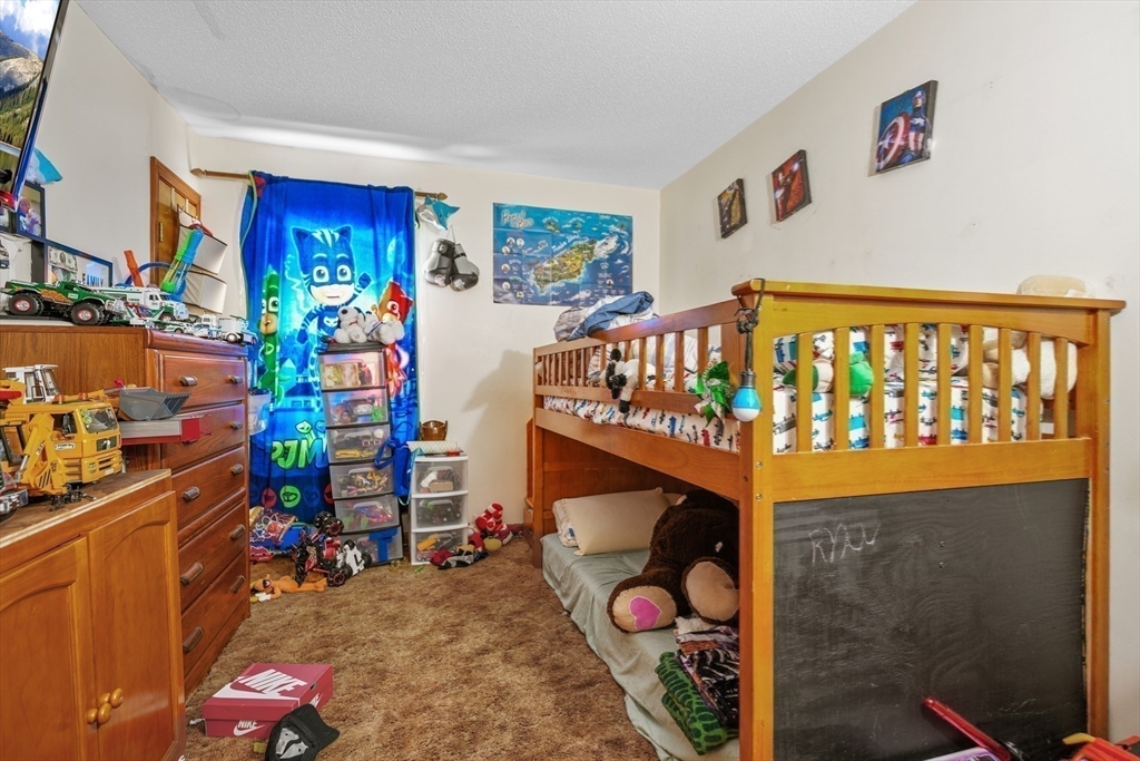 286 Columbia Street Fall River, MA 02721 - Photo 15 of 29 a utility room with lots of different colored cloths