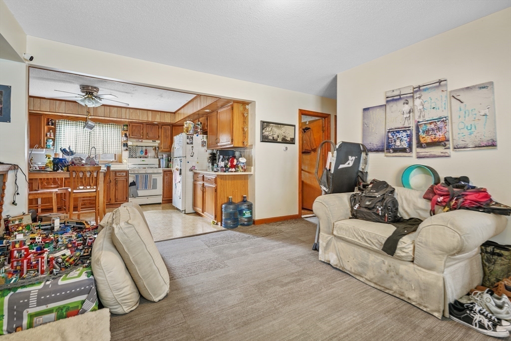 286 Columbia Street Fall River, MA 02721 - Photo 19 of 29 a living room with furniture and a floor to ceiling window