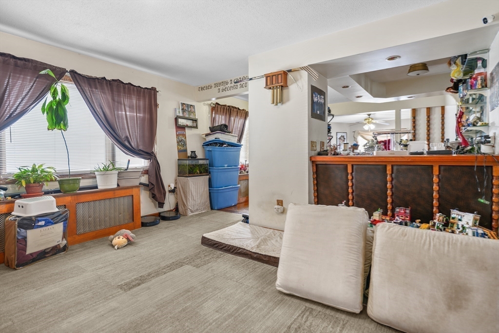 286 Columbia Street Fall River, MA 02721 - Photo 20 of 29 a living room with furniture and a wooden floor