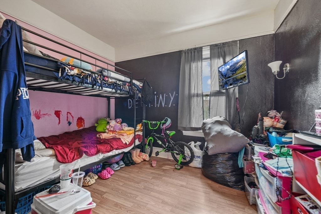 286 Columbia Street Fall River, MA 02721 - Photo 21 of 29 a bedroom with furniture and a wooden floor