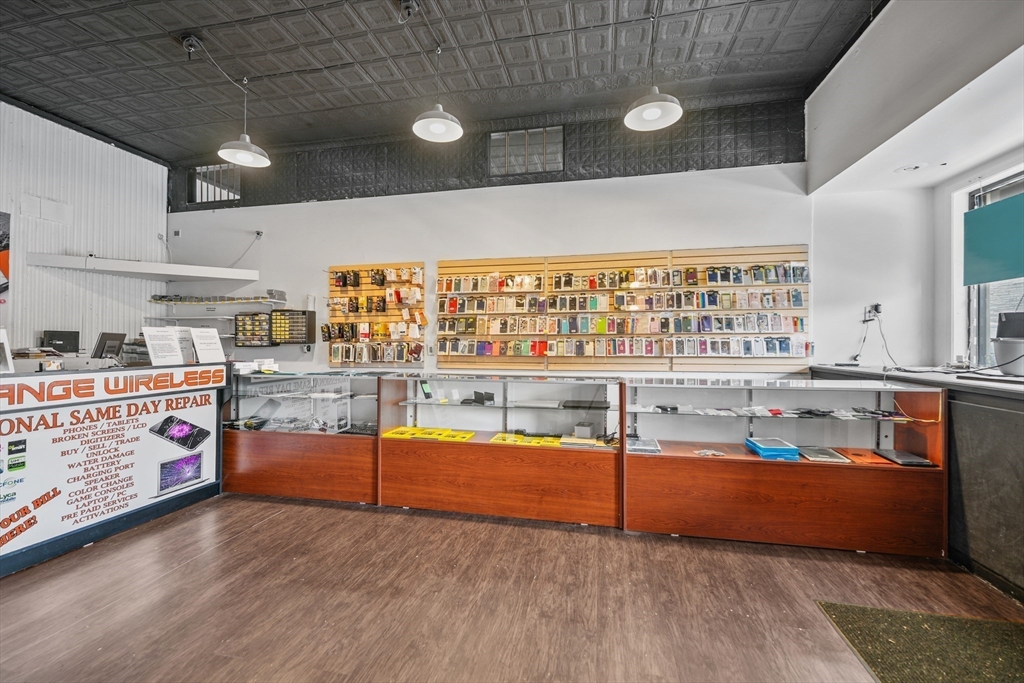 286 Columbia Street Fall River, MA 02721 - Photo 28 of 29 a living room with stainless steel appliances kitchen island granite countertop a sink and cabinets