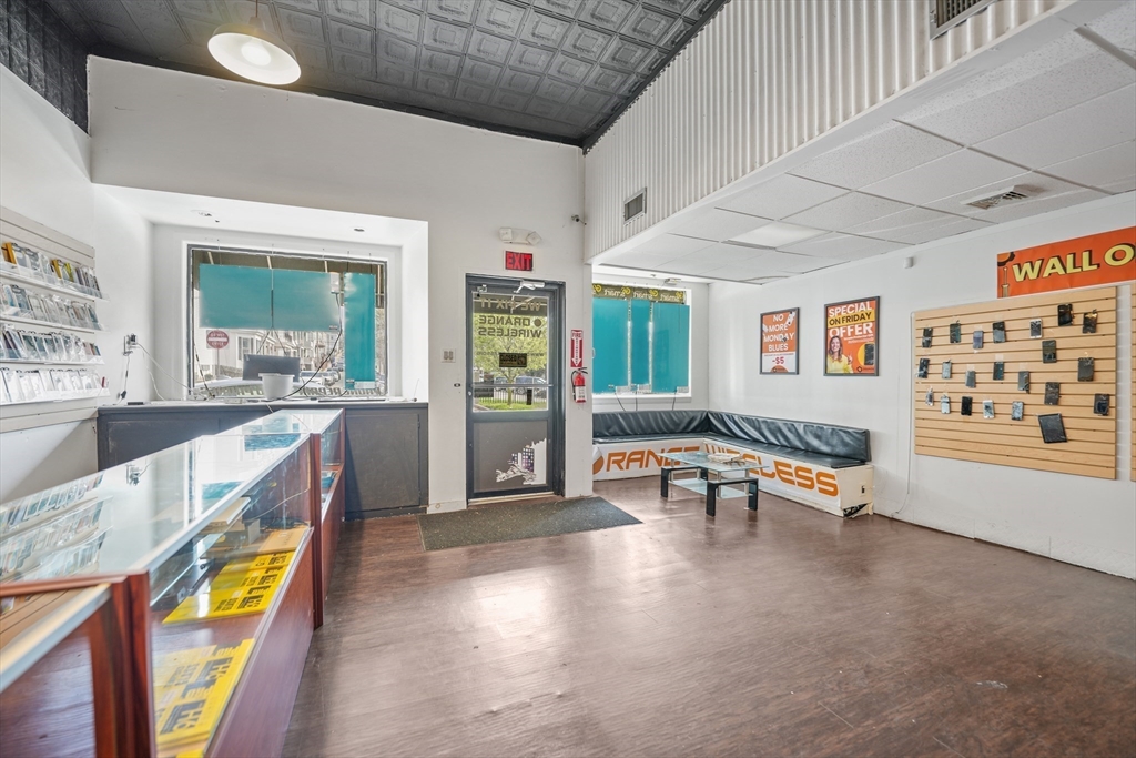 286 Columbia Street Fall River, MA 02721 - Photo 29 of 29 a large hall with dining table and chairs