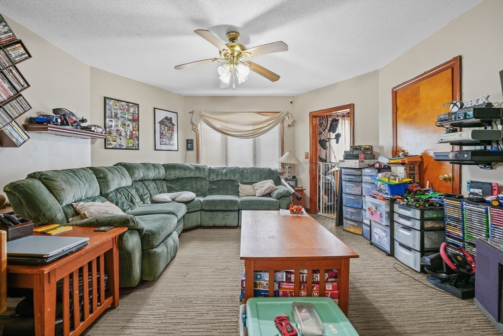 286 Columbia Street Fall River, MA 02721 - Photo 7 of 29 a living room with furniture and a flat screen tv