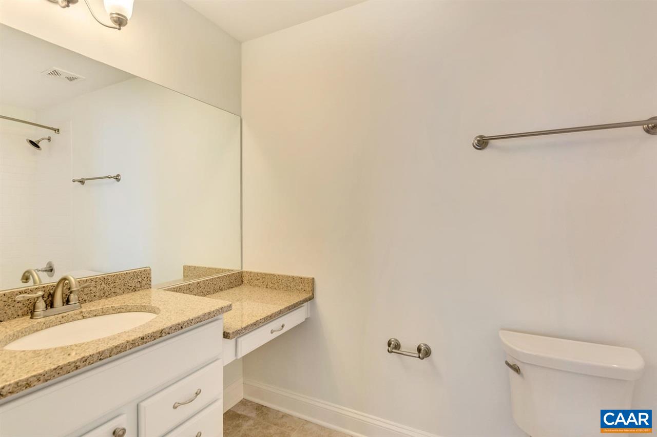 2631 South Bennington Road Charlottesville, VA 22901 - Photo 42 of 44 a bathroom with a granite countertop sink a toilet and a mirror
