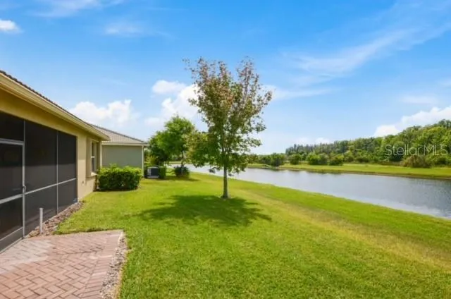 a view of a lake with a big yard