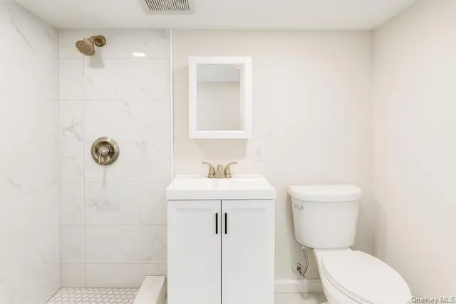 a bathroom with a toilet a sink and bathtub
